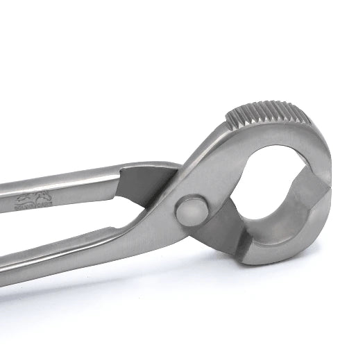 Close-up of serrated-jaw horseshoe puller made of stainless steel for secure grip and easy shoe removal.