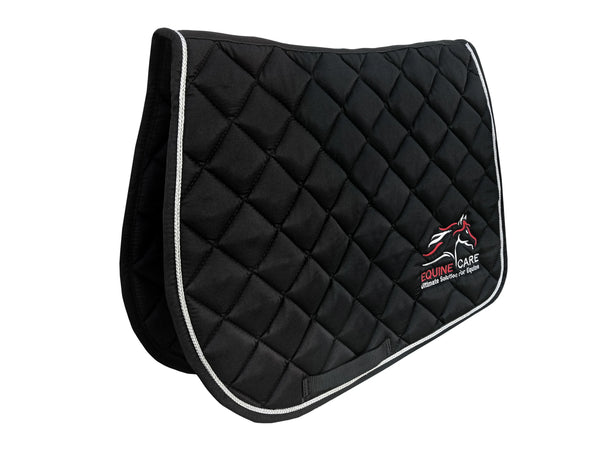 Angled view of black Equine Care quilted saddle pad showing thickness and ergonomic shape
