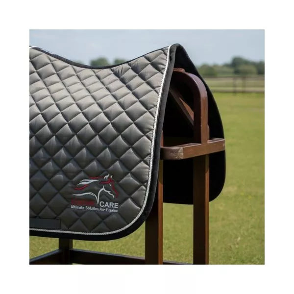 Grey Equine Care English saddle pad with honeycomb quilted padding displayed on saddle stand
