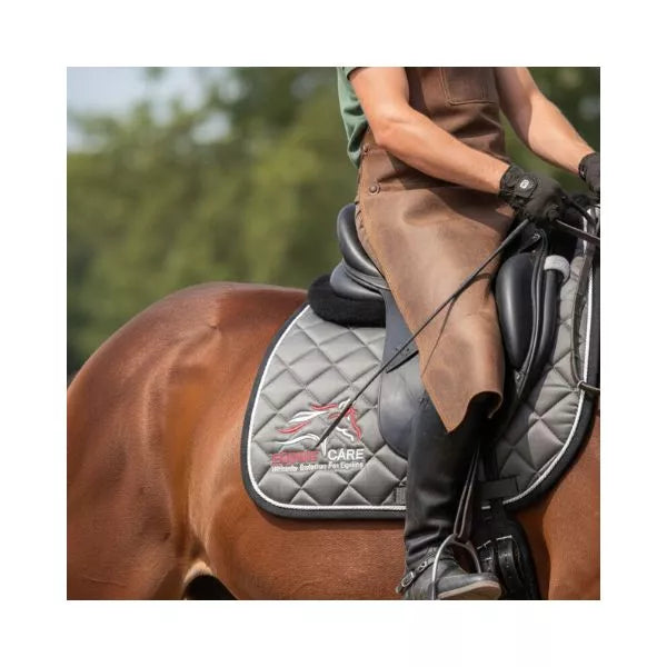 Equine Care full size English saddle pad in grey with honeycomb quilting, non-slip design shown under English saddle on horse