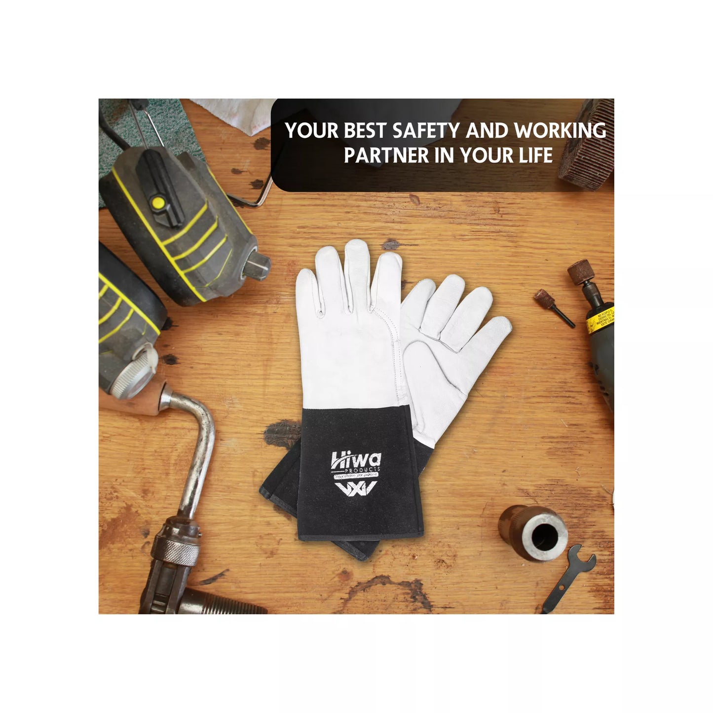Heat resistant work gloves placed on a workshop table with tools, highlighting heavy-duty industrial use.